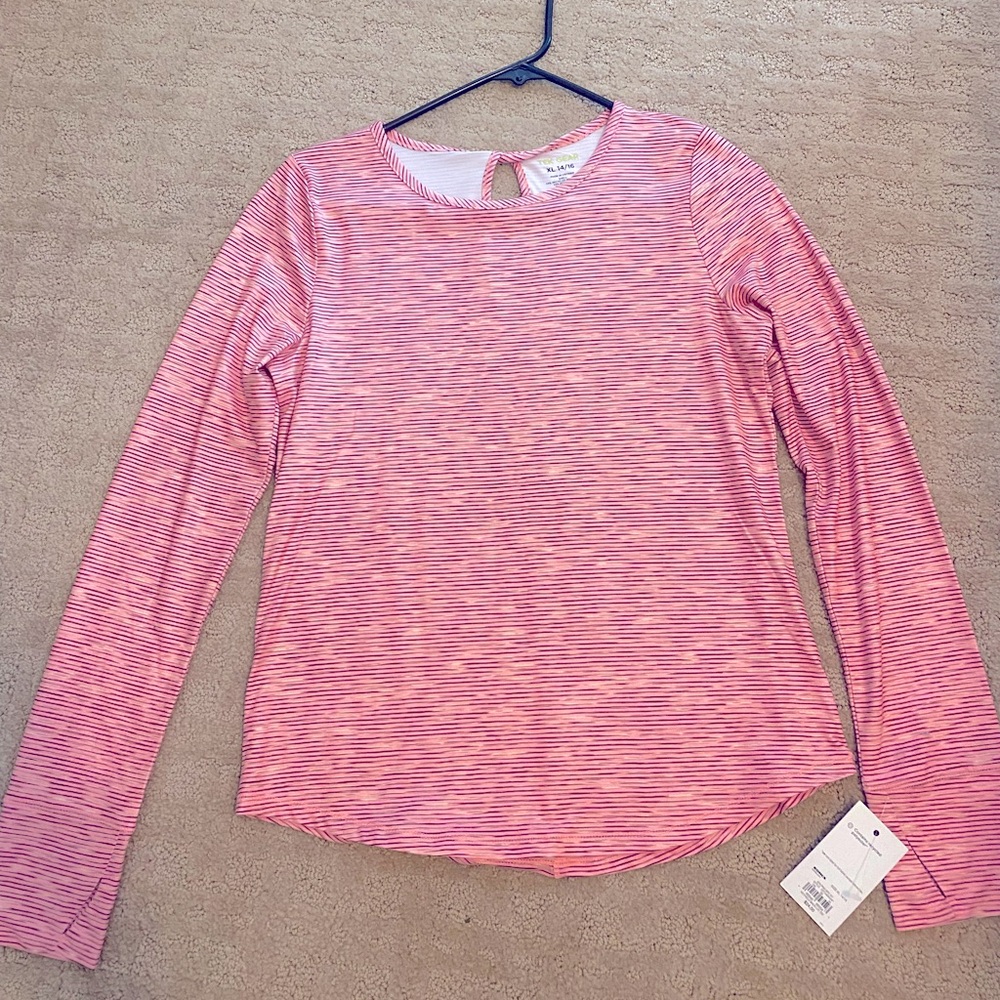 NWT 14/16 athletic top. Dry fit material. Peachy/light pink color. Never worn.